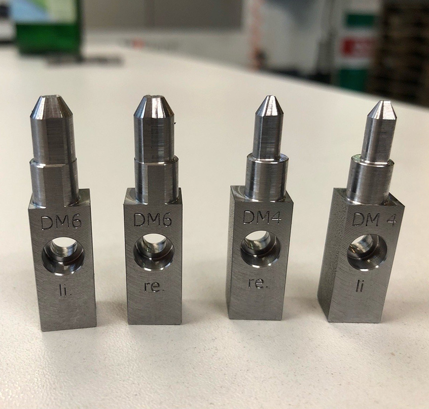 Greiferfinger mit verschiedener Dimensionierung stehen aufgereiht nebeneinander.